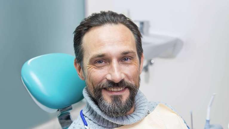 man smiling during dental exam