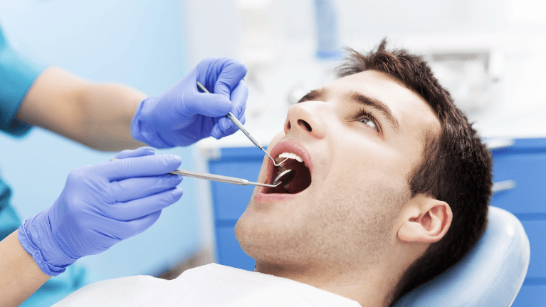 man during a dentist exam in brandon fl