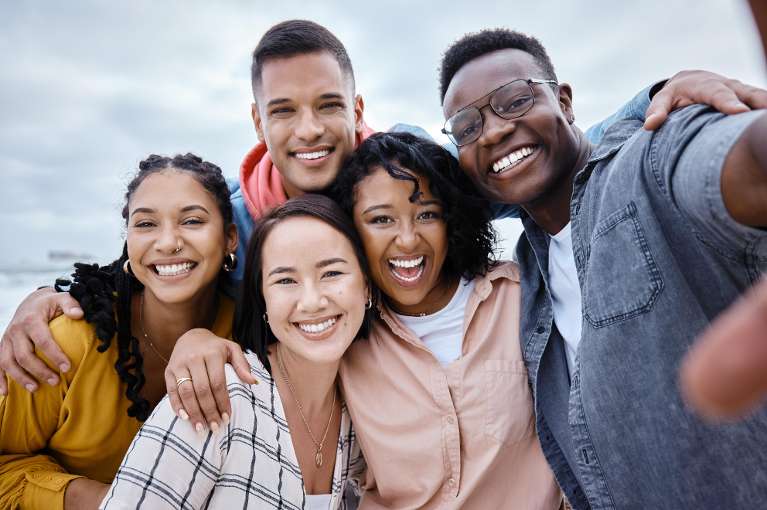 Group of friends smiling with healthy teeth after visiting dentist in Brandon FL