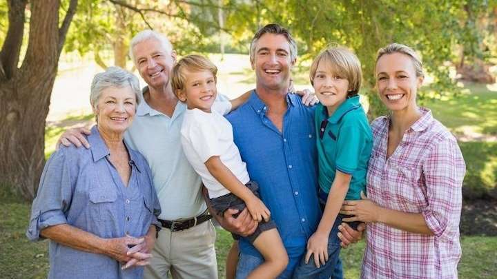 A smiling family posing outside | Dentist Brandon, FL