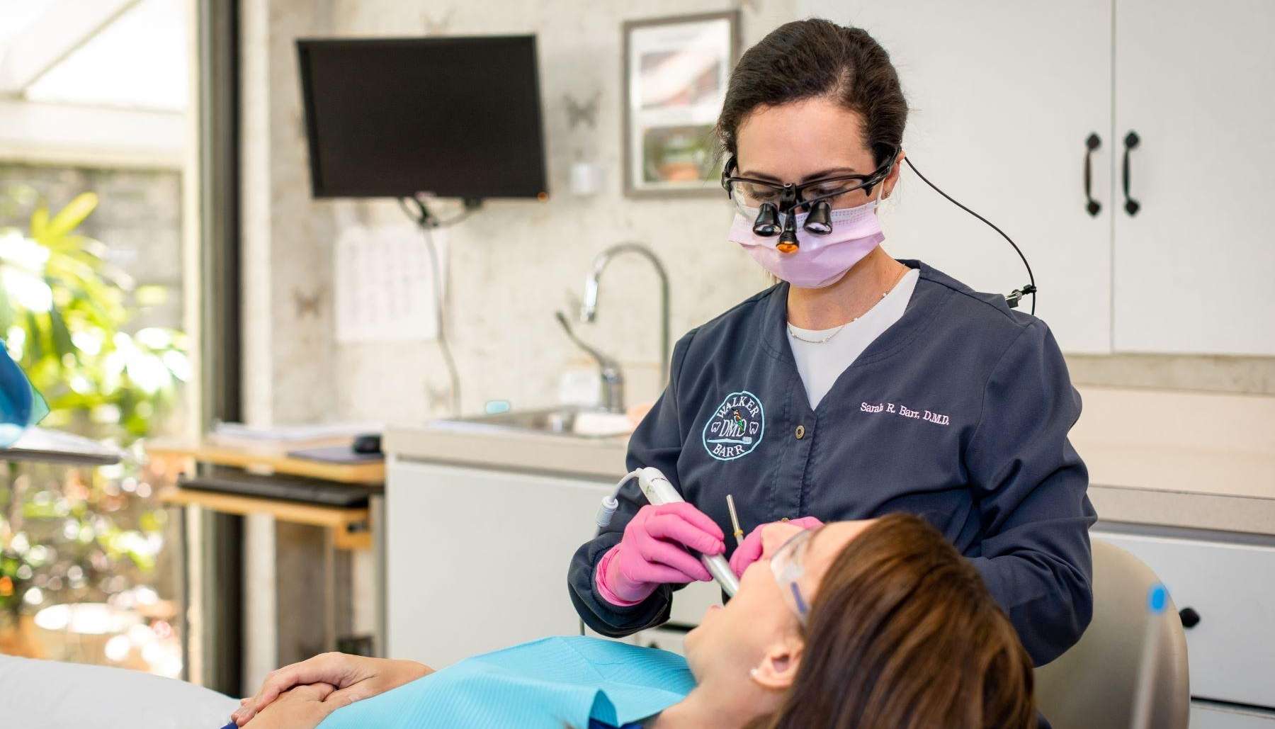 Dentist in Brandon, FL examining patients teeth for root infection