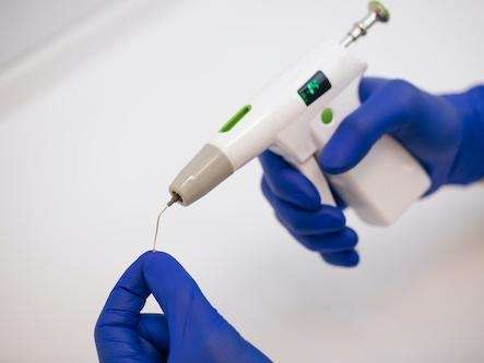 Dentist in Brandon FL holding rotary endodontic tool